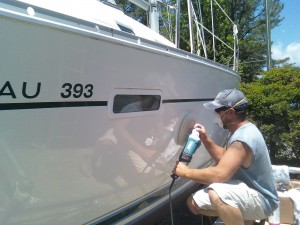 Image of a boat worker-buffing-gelcoat